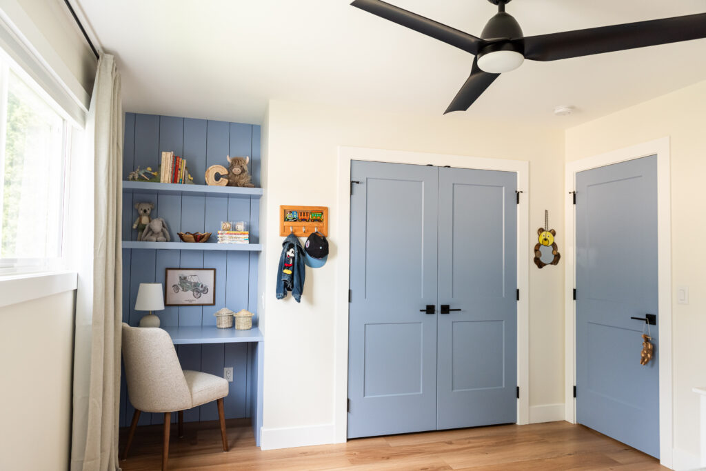 custom blue built in child's desk, shiplap detail, matching closet door