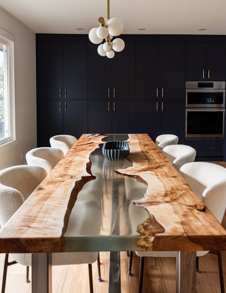 Custom navy pantry wall with floor-to-ceiling cabinetry for high-function family kitchen storage