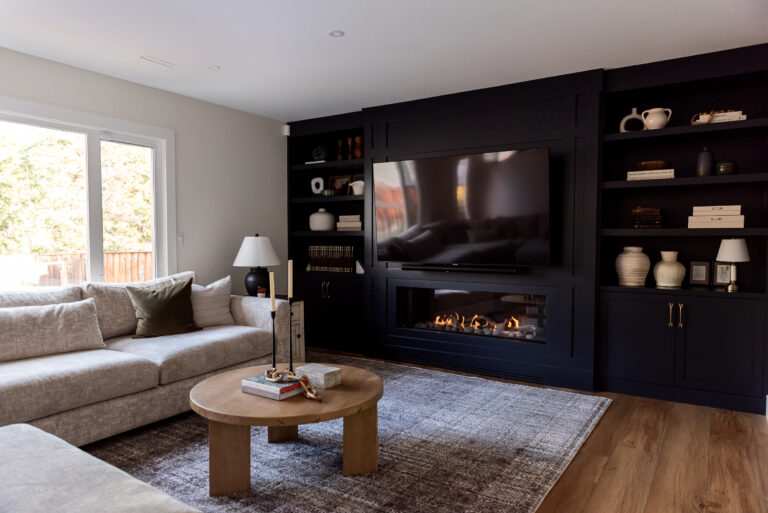 After photo of modern living room with linear fireplace and custom built-in cabinetry