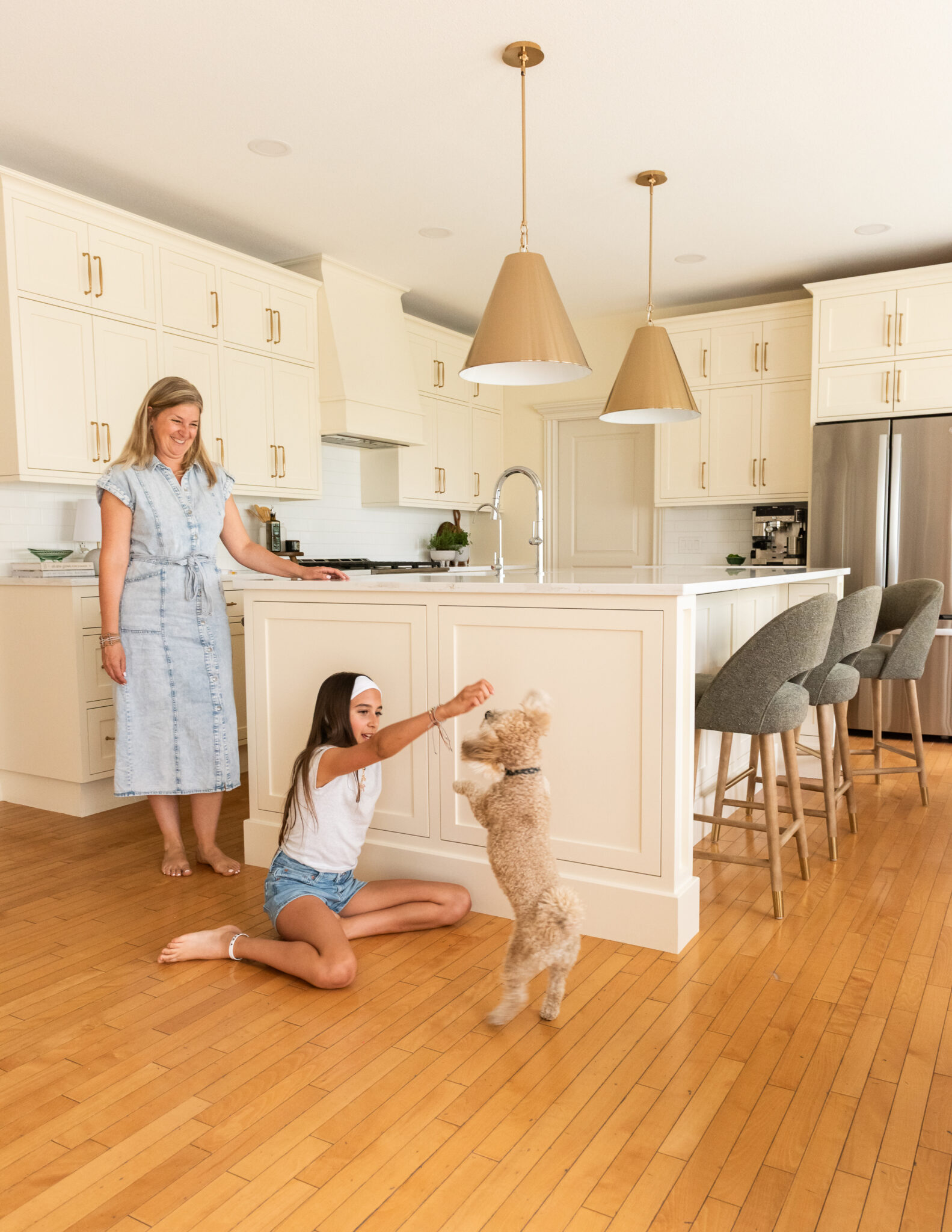 Bright family kitchen renovation with a custom cream island replacing an awkward L-shaped layout, creating a more functional gathering space for everyday living.