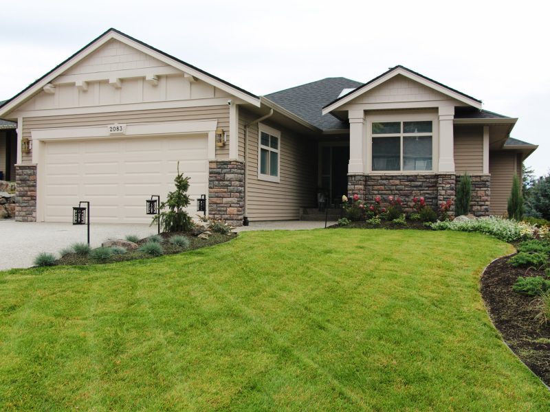 exterior update landscaping and fresh paint on a 2000s home