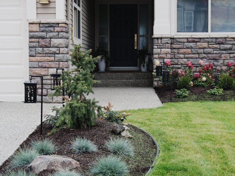 exterior update landscaping and fresh paint on a 2000s home