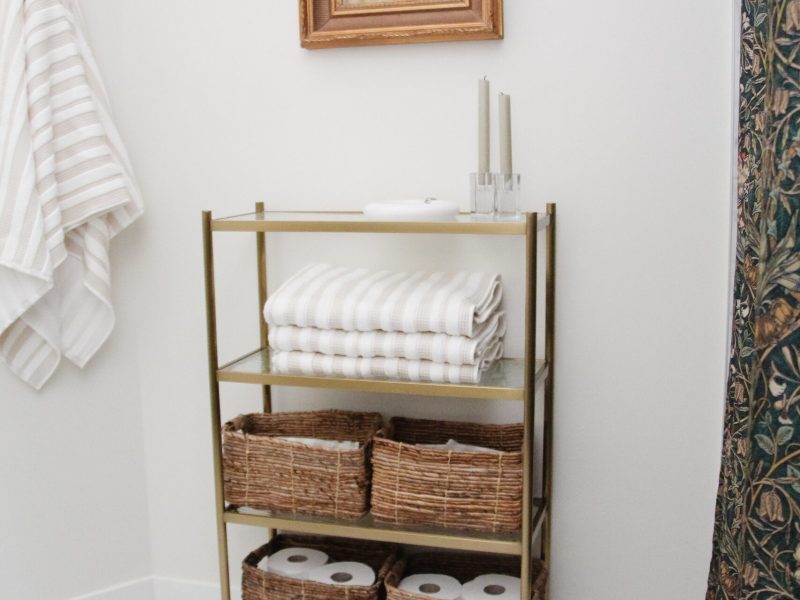 contemporary kids bathroom with etegere and gold accents