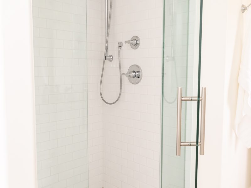 Subway tile shower hex floor tile white bathroom