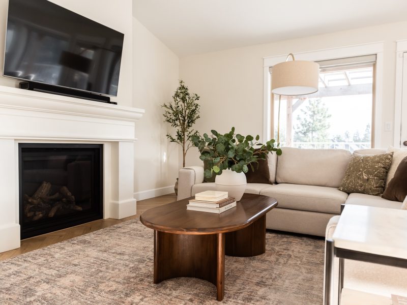 transitional living room cast stone fireplace, floor mirror