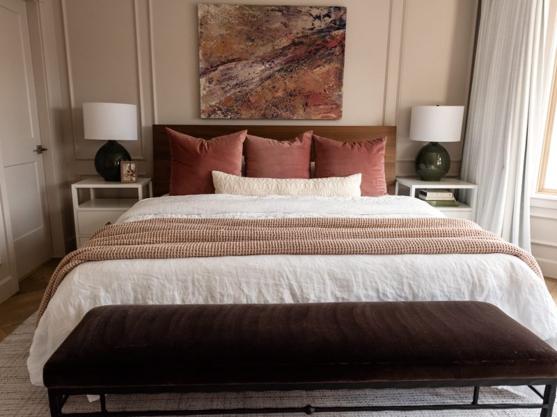 blush bedroom with abstract art pink green purple