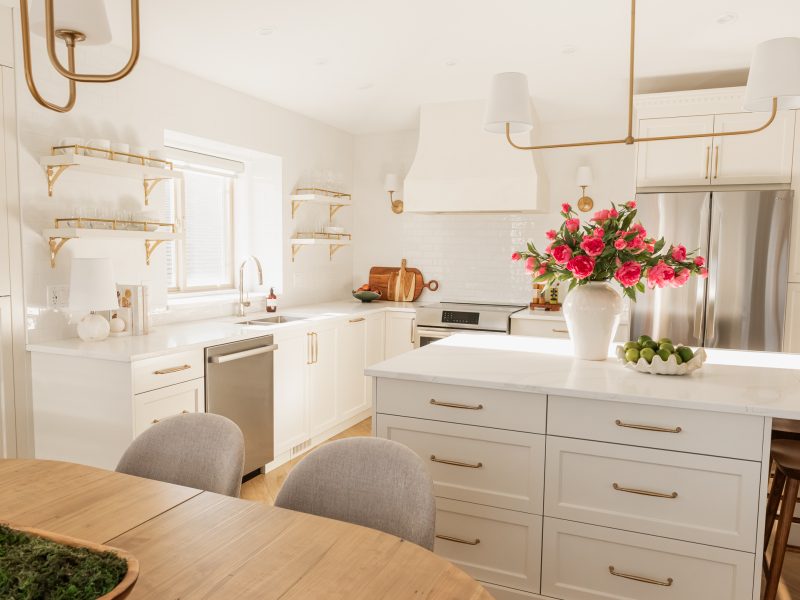 transitional cream kitchen, plaster hood, open brass shelves, tile to ceiling