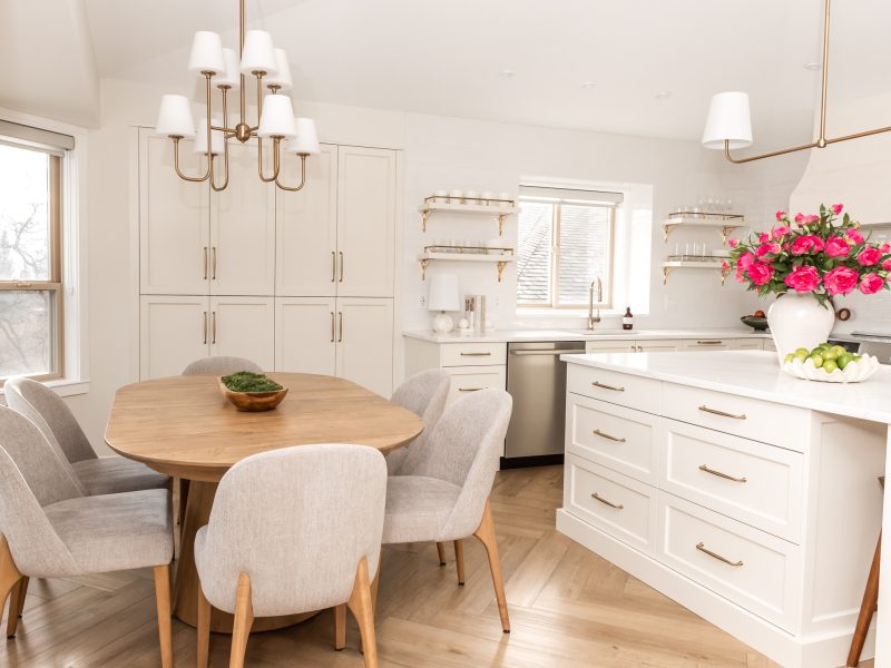 transitional cream kitchen, plaster hood, open brass shelves, tile to ceiling