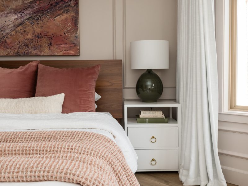 blush bedroom with abstract art pink green purple