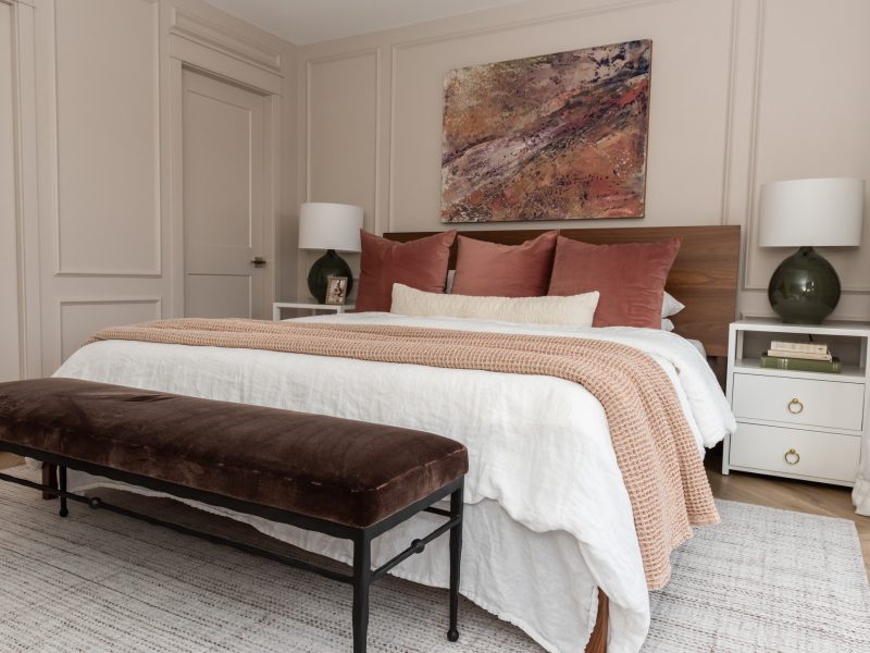 blush bedroom with abstract art pink green purple