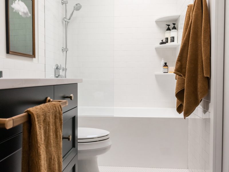 green vanity, timeless bathroom, colourful bathroom, green vanity, subway tile half wall