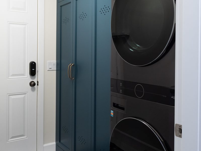 custom vent holes in cabinetry locker blue laundry mudroom combo