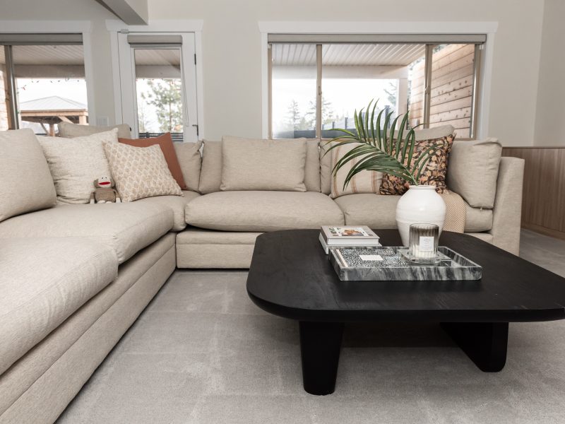 basement games room, sectional and coffee table styled